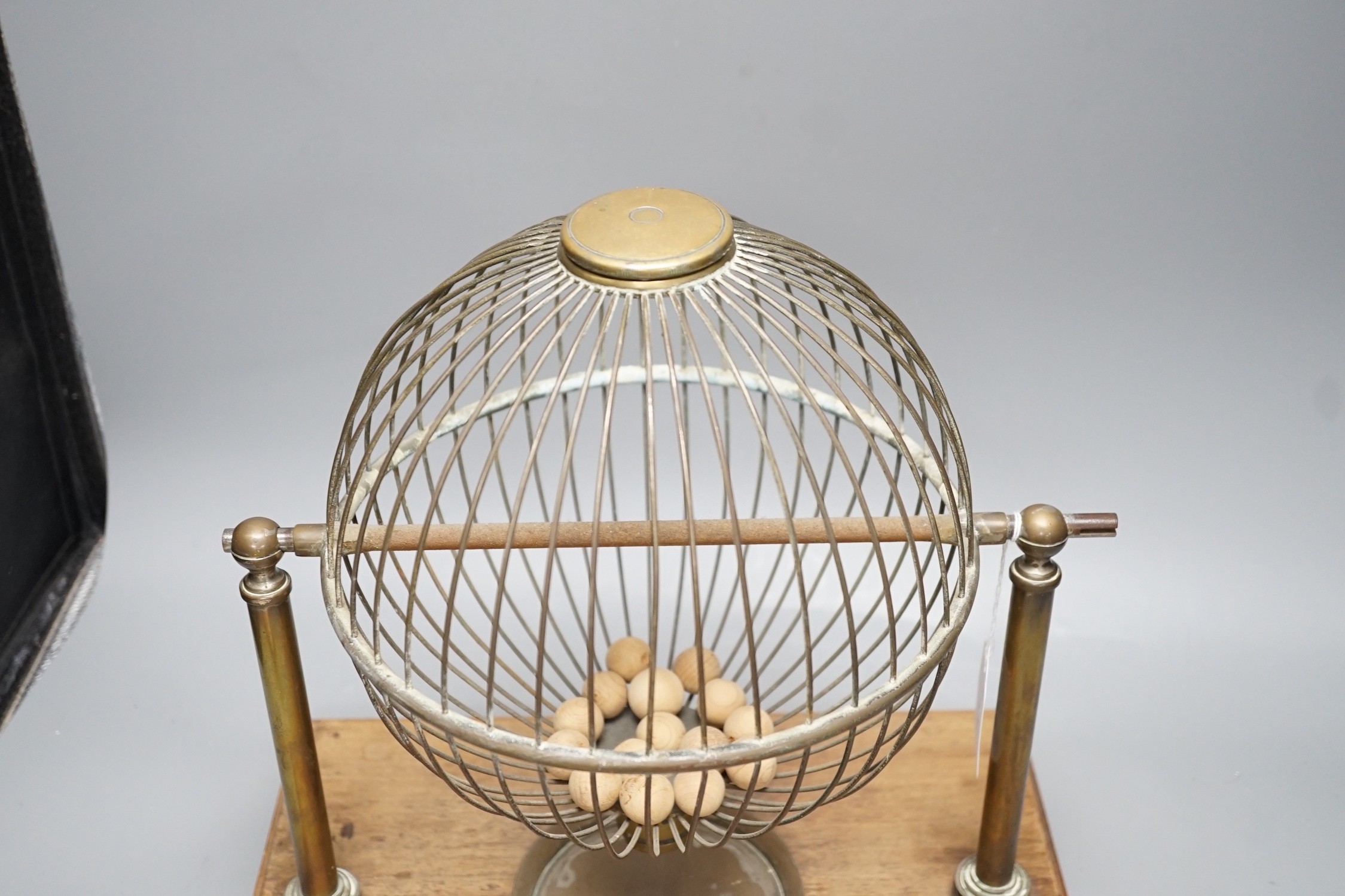 A mahogany and brass gaming tombola cage